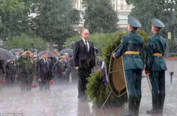 Russian President Vladimir Putin Gets Soaked By Rain During Public Ceremony Photos